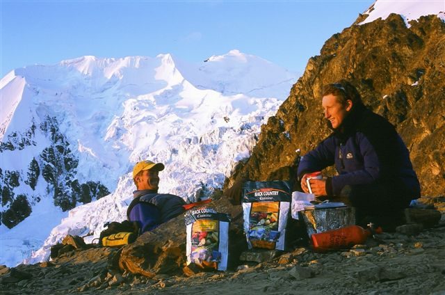 Trampers in the back country carrying lightweight freeze dried food